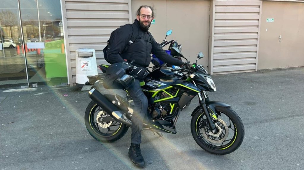 Photo of Djamel Ouddah posing on his motorbike.