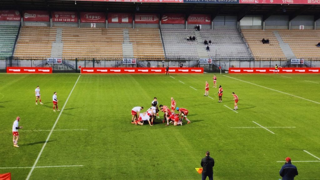 Wide shot of the field where a scrum is about to be played.