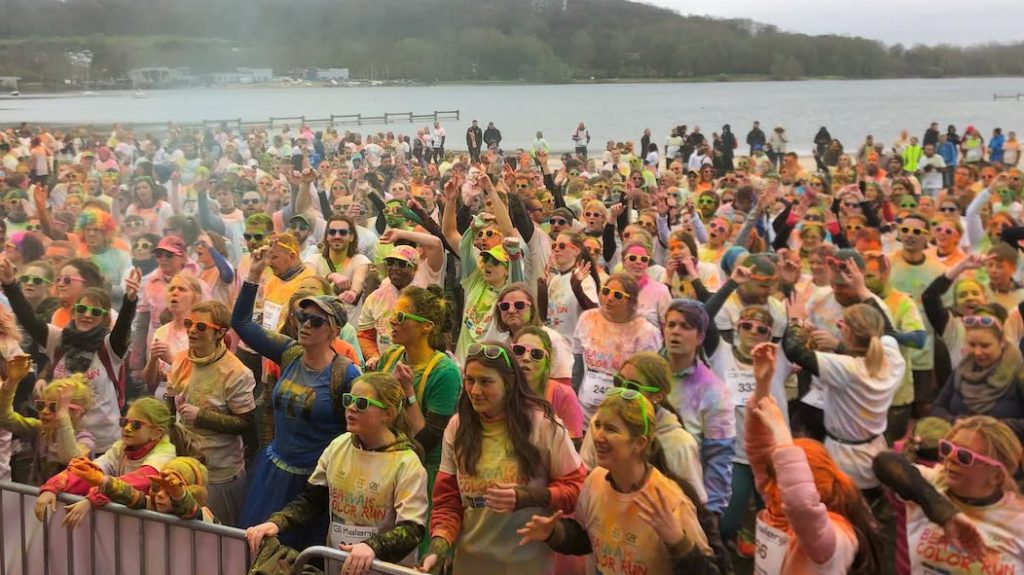 Photo of colorful participants at the end of their race.